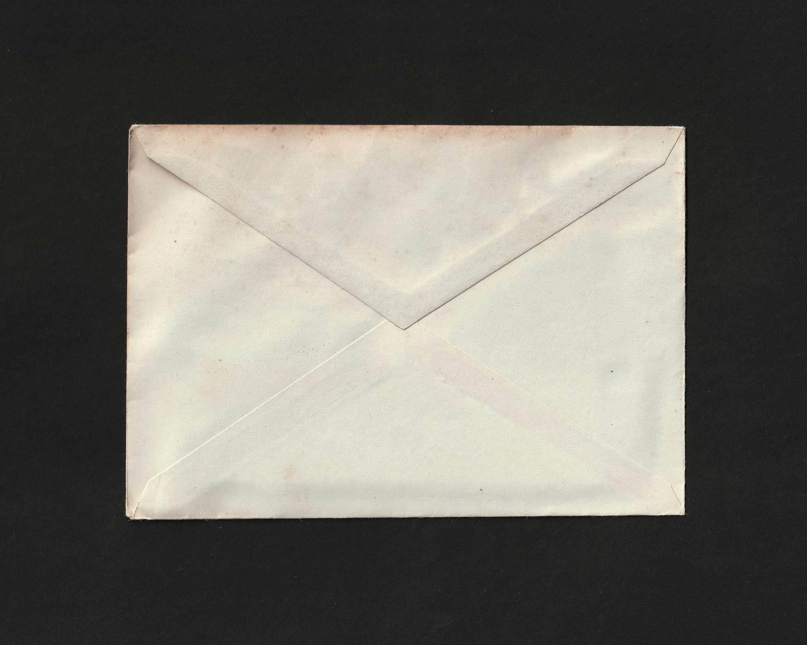 A brass-fastened envelope holding a quarter-curiosity
