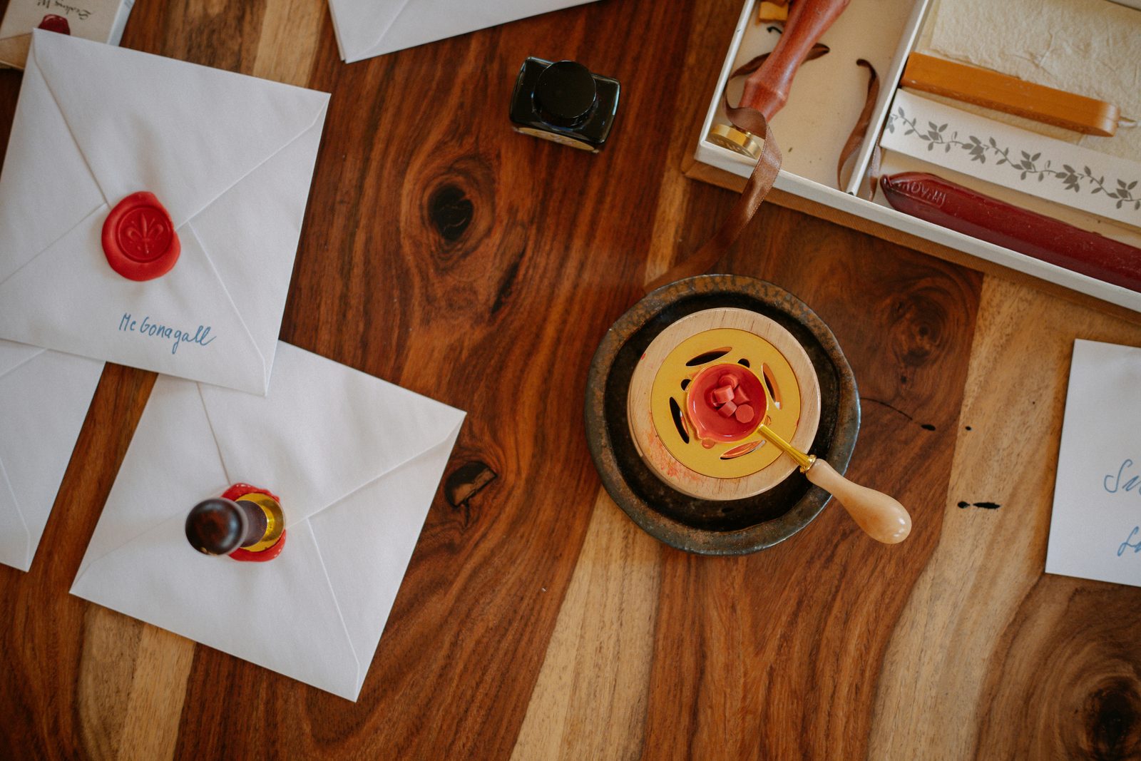 Sealing wax and a brass stamp on the cabinet bench